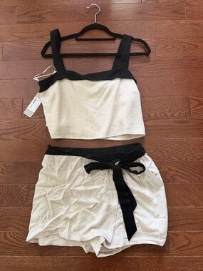 Two-Piece Cream and Black Crop Top + Skort Set